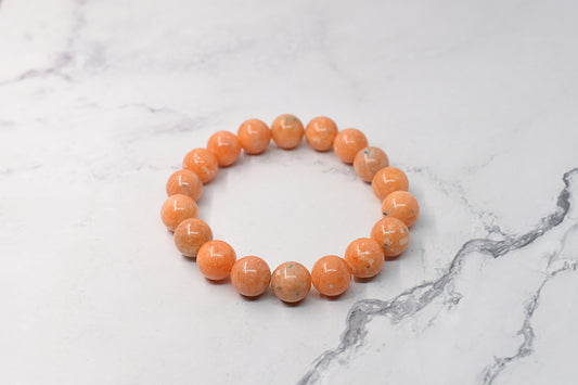 Bracelet en pierre calcite orange 10mm, fait à la main au Québec