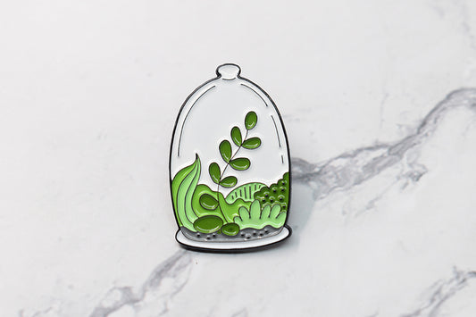 Broche en émail terrarium avec plante