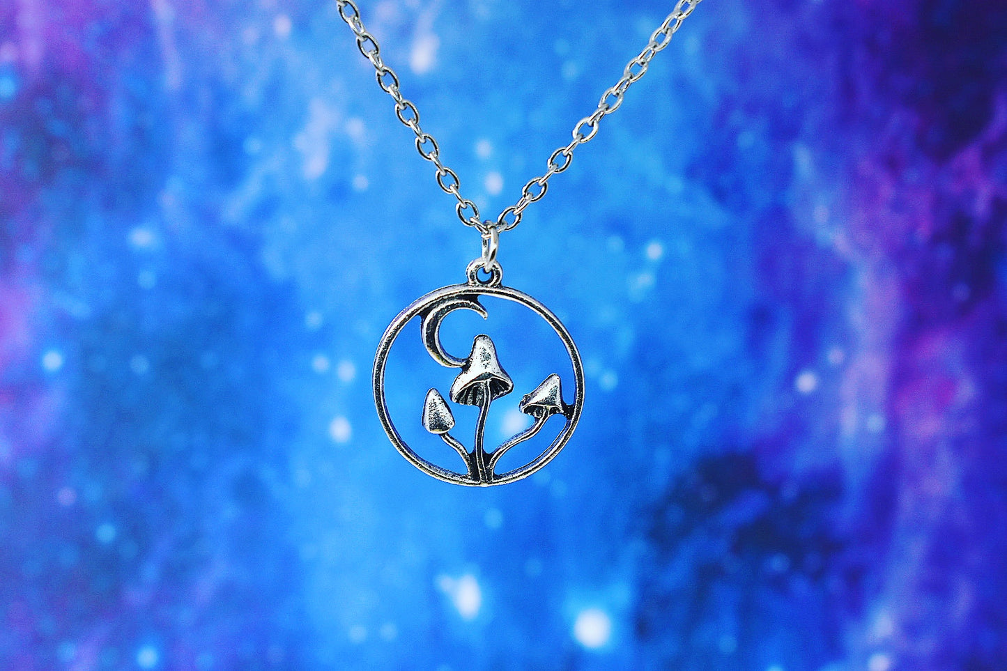 Necklace with mushroom and crescent moon pendant