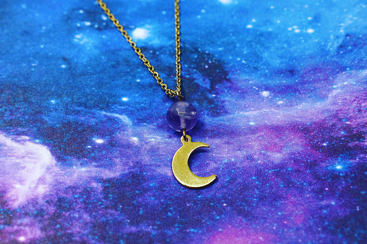 Gold crescent moon pendant with amethyst stone