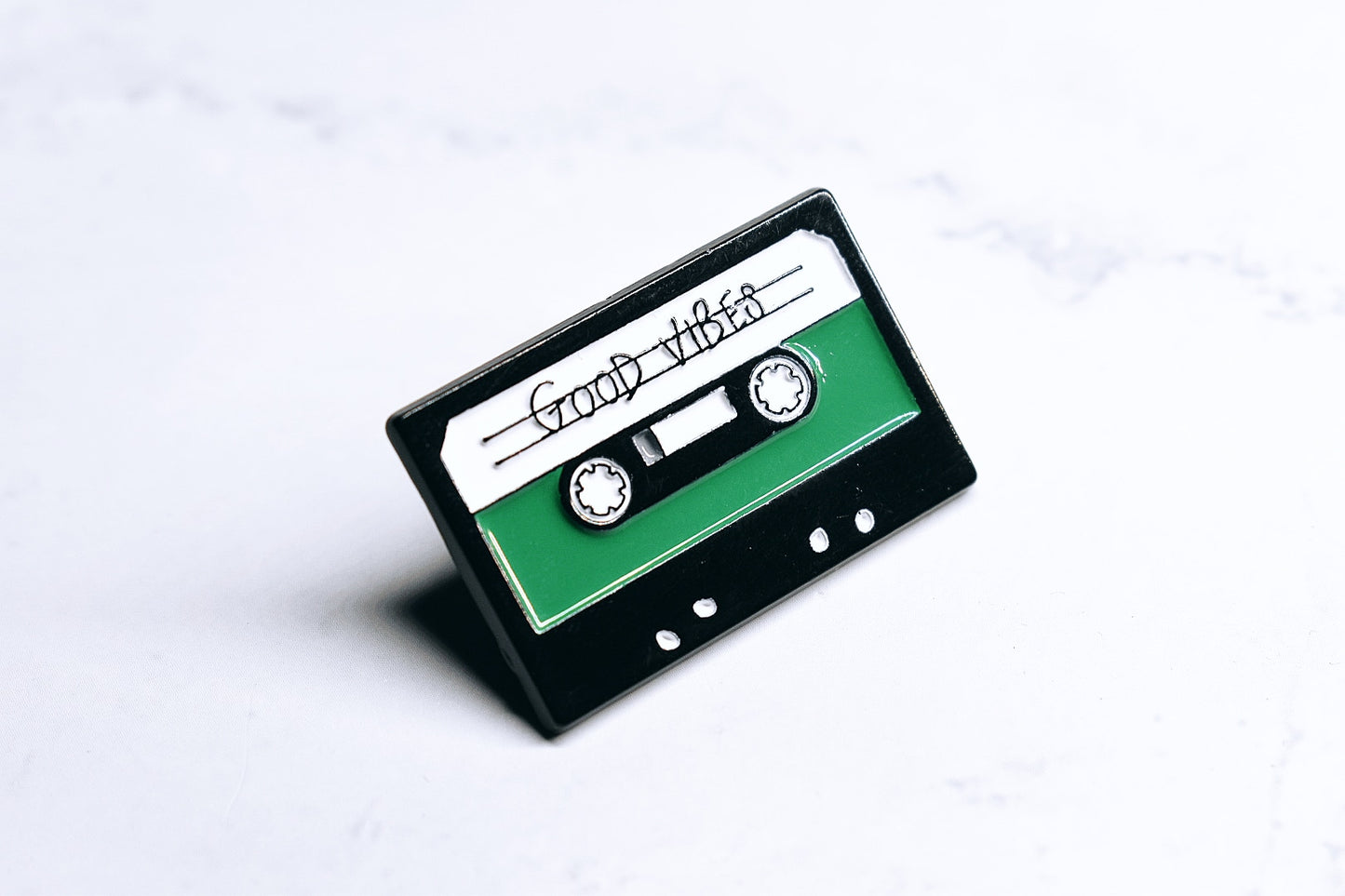 "Good Vibes" Enamel Pin in the Shape of a Vintage Audio Cassette