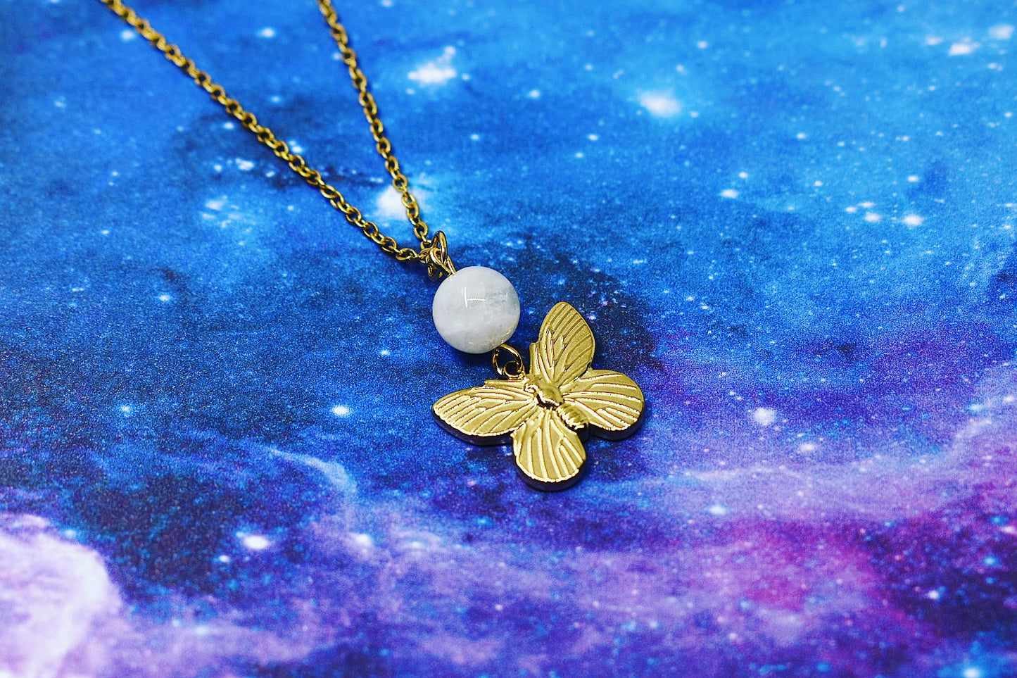 Gold butterfly pendant with moonstone
